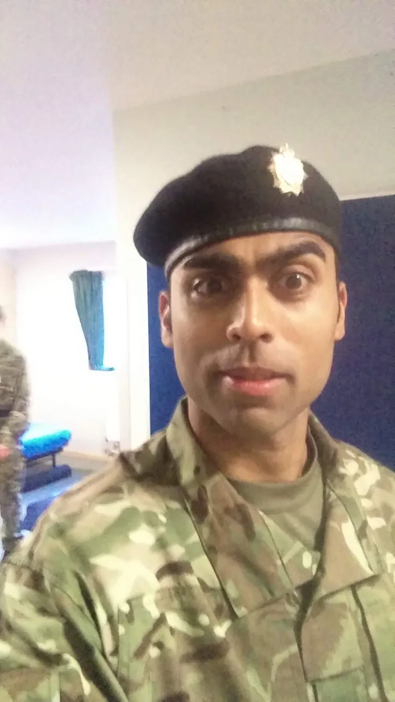 Deepak Shukla wearing a beret indoors.