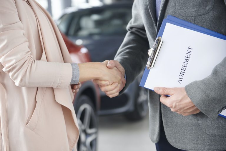 Close up of handshake customer and salesman